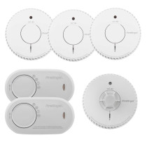 Six FireAngel alarms: four round smoke alarms, one round heat alarm with a different sensor design, and two rectangular carbon monoxide alarms.