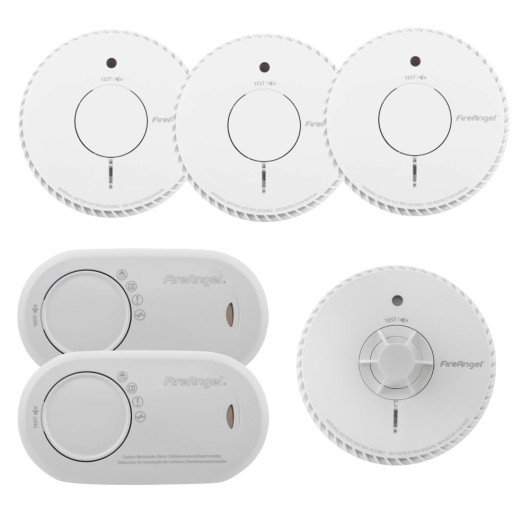 Six FireAngel alarms: four round smoke alarms, one round heat alarm with a different sensor design, and two rectangular carbon monoxide alarms.