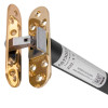 angled close up of an astra 3003 series concealed fire door closer showing the metal hinge and label on the cylinder