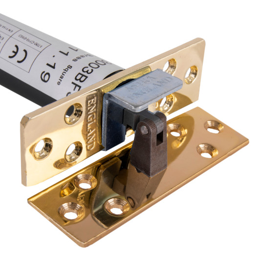 Close-up angled view of an astra 3003 series concealed fire door closer showing metal parts and mounting holes