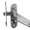 angled close up of an astra 3003 series concealed fire door closer showing metal components and mounting plate