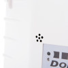 Closeup of the sounder holes on a dorgard fire door retainer white showing part of the label text