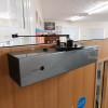 freedor smartsound door closer mounted on a door with a view over the top part of the door
