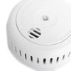 Closeup of the sounder on a firehawk optical smoke alarm showing speaker vents and test button