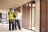 Two men in hard hats reviewing building plans inside a construction site for Fire Strategy