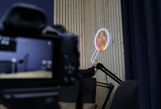 A podcast studio showing the FireWatch logo