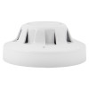 Side view of the apollo series 65 optical smoke alarm showing its white circular design and ventilation slots