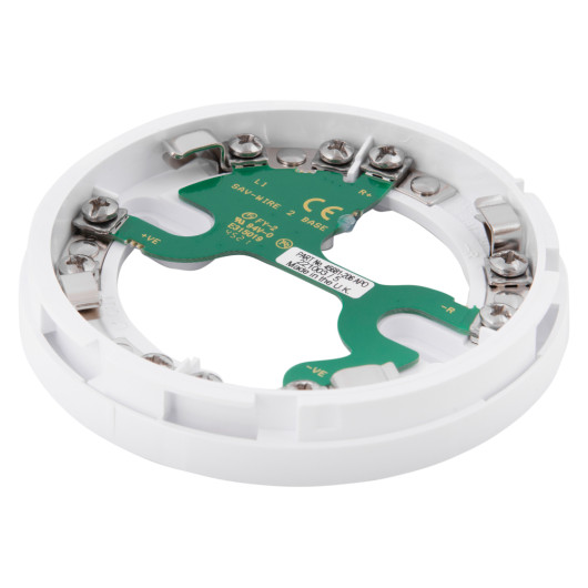 angled view of the apollo series 65 sav wire detector base showing white circular frame with green circuit board and metal connectors