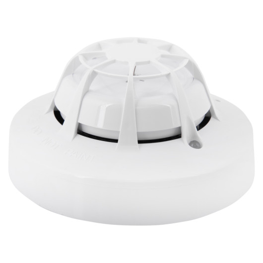 angled view of the apollo discovery multi sensor detector showing its round white casing with vents and central dome