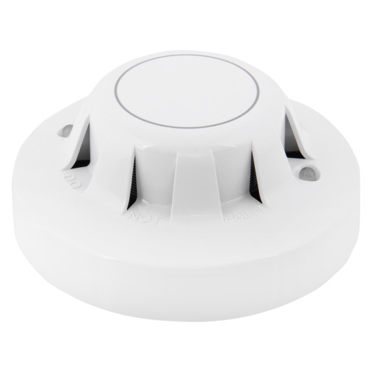 angled view of the apollo discovery optical smoke detector showing its circular white design with ventilation openings
