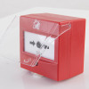 apollo transparent hinged manual call point cover being lifted open on a red manual call point device