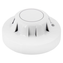 angled view of an apollo xp95 optical smoke detector showing its circular white design with vents around the sides