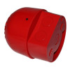 A side-angled underside view of a red fire alarm sounder, showing the circular cable entry knockouts on the base and the smooth curved housing above.