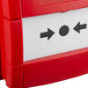 Closeup of kac weatherproof manual call point surface mounted with red casing and black arrow symbols on white panel