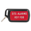 Front view of the evacuator synergy rf key fob showing a black device with a red label reading site alarms key fob