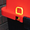 Yellow tamper pin on the fmc campsite cabinet shown against a red and black surface