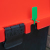 Close-up of fmc campsite cabinet showing a green tamper seal on the red lid and black clip