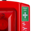 Closeup front view of evacuator synergy plus wireless call point site alarm first aid with red casing and green first aid sign