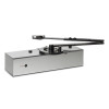 A metallic automatic door closer with a rectangular housing, an articulated arm on top, and small adjustment controls and indicator lights on the front.