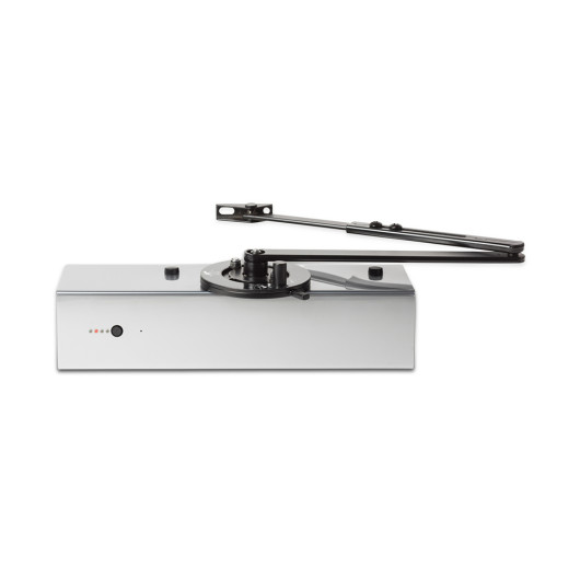 A surface‑mounted automatic door closer featuring a rectangular housing, an articulated arm, a circular adjustment dial, and small indicator lights.