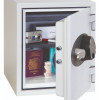 phoenix titan 1282 fingerprint lock shown on the door opening of a safe containing various personal items