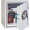 phoenix titan 1282 key lock safe with its door open showing a passport, camera, and other items inside