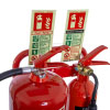 a close up shot of a double metal fire extinguisher in red holding two fire extinguishers with relevant ID signs