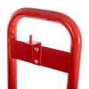 a close up of a CO2 lug bracket on the back brace of a metal red single fire extinguisher stand