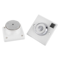230v 200n conquest steel flush mounted door retainer showing two white mounting bases with circular steel parts and a switch