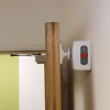 Geofire Agrippa acoustic fire door holder attached to a wooden door and wall shown in use