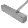 Silver back body of a geze ts4000 overhead door closer showing the rectangular metal casing and arm attachment point