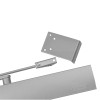 Close up of the silver bracket component of the geze ts4000 overhead door closer showing mounting holes and arm connection