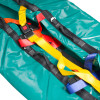 Closeup of bariatric evacmat showing green fabric with colourful straps and secure black buckles