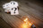 A stack of question mark cards next to a glowing light bulb
