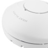 Close up of a hispec rf pro heat alarm showing the device surface and central button