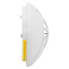 Side view of the hispec rf combi mains heat carbon monoxide detector showing its white casing and warning label