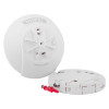 HiSPEC heat alarm and its separate mounting base, featuring a radial sensor grill, red securing pin, and printed labels including “DO NOT PAINT” and “PUSH TO REMOVE.”