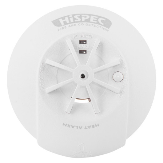 Front of a HiSPEC heat alarm with labeled “AC POWER” and “ALARM” indicators, a “PUSH TO TEST / SILENCE” button, and a “SLIDE TO REMOVE” arrow at the bottom.