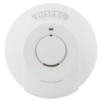 White circular smoke alarm labeled “FIRE AND CO DETECTION” with a central button for testing and silencing, and indicators for “AC POWER” and “ALARM.”