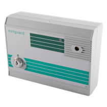 angled view of the exitguard fire door security alarm showing its white and green rectangular casing with a key lock on the front