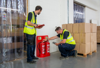 2 engineers checking installed fire extinguishers