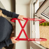 Hs2Stfel Hs3Stfel Ultrafire fire escape ladder being deployed through an open window with hands holding it
