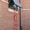 Red Hs2Stfel Hs3Stfel Ultrafire Fire Escape Ladder Office 8 hanging from an open first-floor window on a brick building