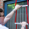Person in situ installing Hs2Stfel Hs3Stfel Ultrafire Fire Escape Ladder office window with red straps and white rungs