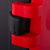 Close-up of a hinge detail on a hose reel cabinet showing red and black plastic parts