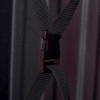 Close-up of black straps with a plastic clip on a hose reel cabinet background