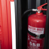 single extinguisher cabinet with an open door showing a red water mist extinguisher inside