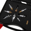 Closeup of fire extinguisher adaptor kit nitrogen regulator hose metal fittings arranged in foam-lined case