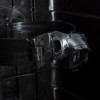 Close-up inside the firechief cabinet 12kg extinguisher showing the metal securing strap and interior structure
