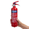 firechief 600g powder fire extinguisher held in a hand against a white background